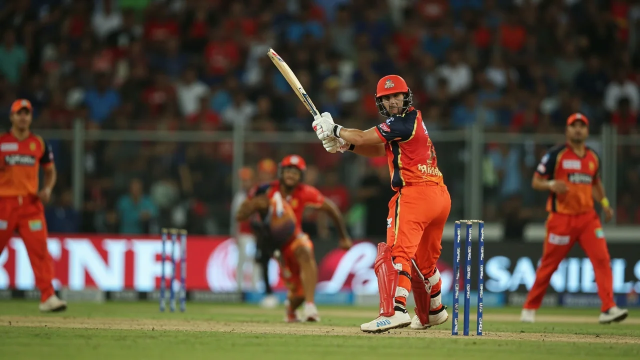 Medium tactical view from behind the stumps showing the fielding setup during an IPL powerplay, with multiple fielders inside the ring and the bowler in his delivery stride